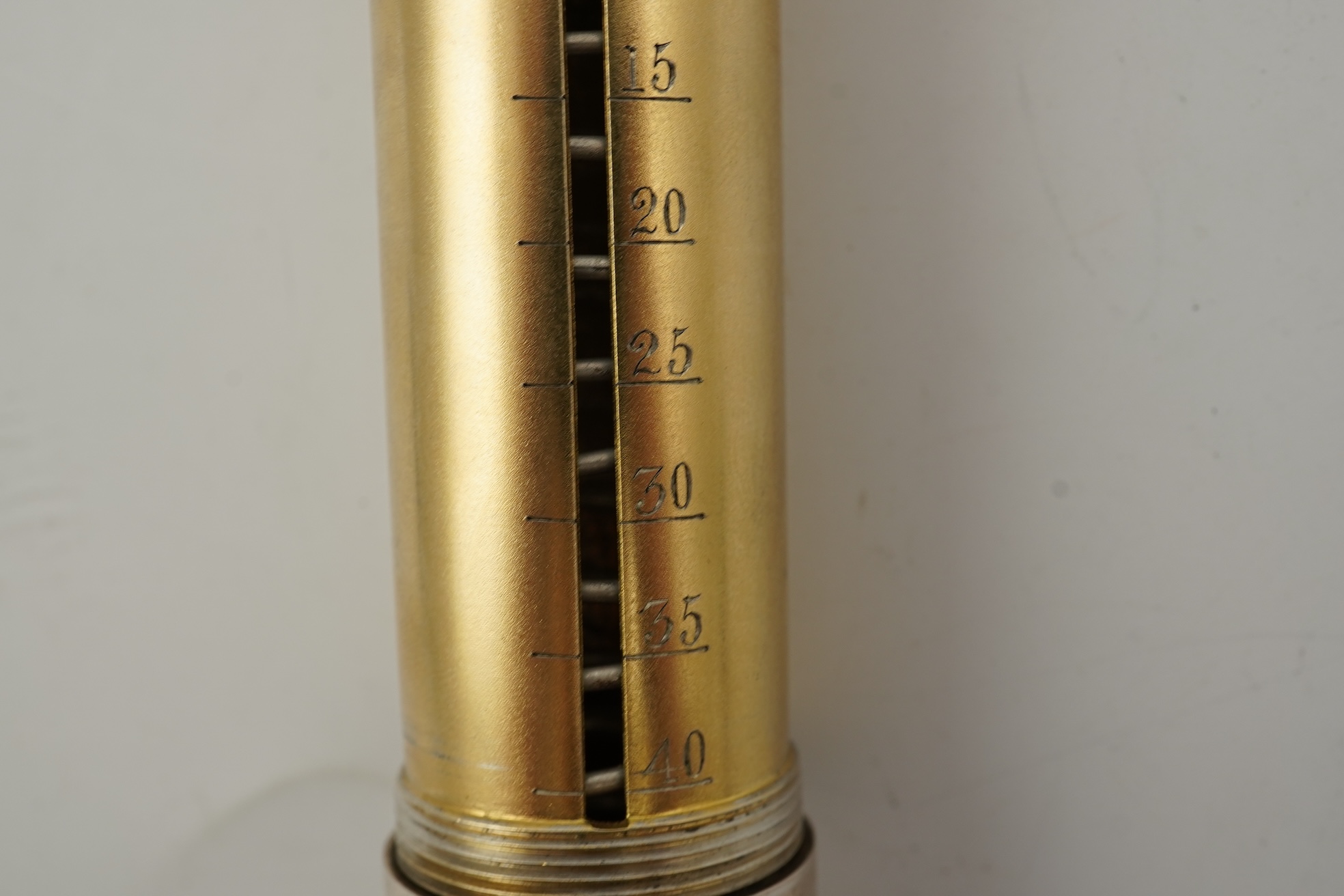 A late Victorian parcel gilt silver tubular coin holder, by Frederic Purnell